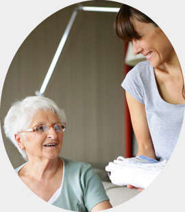 Female companion helping elderly lady